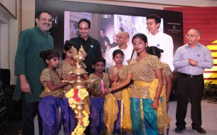 Lighting of the lamp by dignitaries and Akshaya Patra beneficiaries