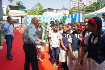 Mr Shridhar Venkat, the CEO of Akshaya Patra, in a joyful moment with children