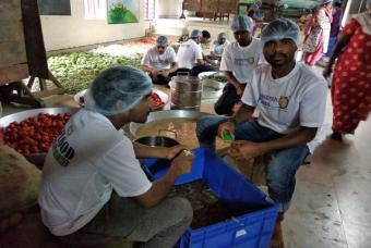 Volunteers ensuring all vegetables are thoroughly washed