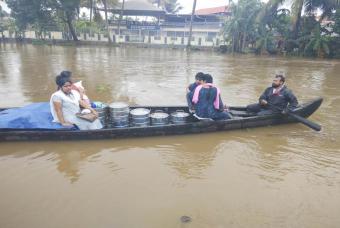 Packaged food being transported by boat across the flood affected regions 