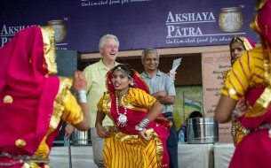 Clinton is delighted to watch a cultural programme arranged at the school. Photo credit: Clinton Foundation/ Barbara Kinney