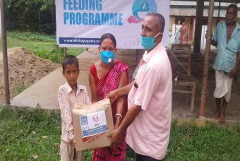 Families come to receive the relief supplies