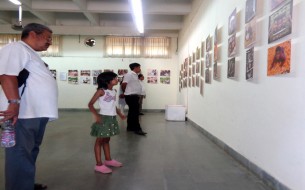 Visitors look at the Images